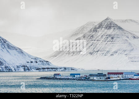 Dramatic winter landscape of Önundarfjörður fjord and mountains above Flateyri in the Westfjords region of Iceland Stock Photo