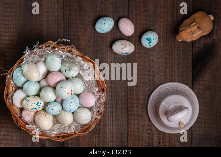 Basket full of Easter eggs and bell Stock Photo