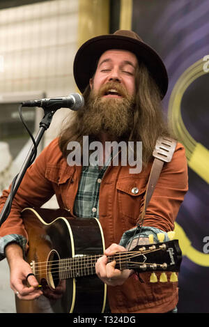 Bearded man playing guitar Stock Photo