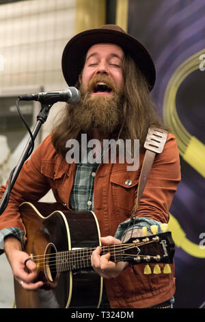 Bearded man playing guitar Stock Photo