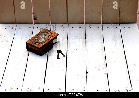 Wooden chest, decorated with antique keys Stock Photo