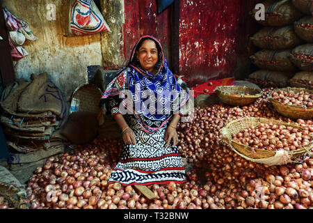 An Onion warehouse in the wholesale market in the Sadarghat area by the river in Dhaka. Stock Photo