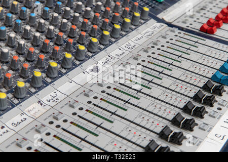 Analog sound mixing console used to mix microphones Stock Photo