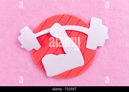 muscular built concept image. paper pink background Stock Photo