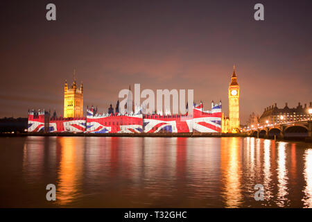 Union Jack Flag projected onto the Houses of Parliament at dusk london england Stock Photo