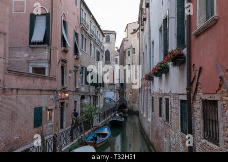 Venice, Italy - June 30, 2018: Panoramic view of Venice canal with historical buildings and gondolas from bridge. Landscape of summer evening day Stock Photo