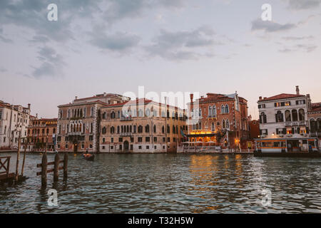 Venice, Italy - June 30, 2018: Panoramic view of Venice grand canal view with historical buildings and gondola. Landscape of summer evening day and co Stock Photo