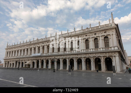 Venice, Italy - July 1, 2018: Panoramic view of facade of Museo Correr and Piazza San Marco, often known as St Mark's Square, is the principal public  Stock Photo