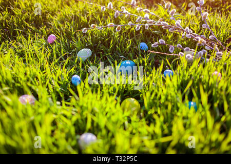 Happy Easter. Easter eggs hidden in spring grass. Holiday decoration Stock Photo