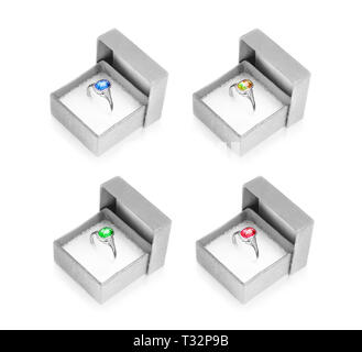 white-metal finger rings in own gift boxes, set Stock Photo