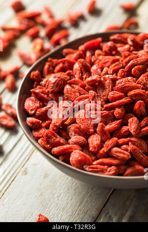 Raw Red Organic Goji Berries in a Bowl Stock Photo