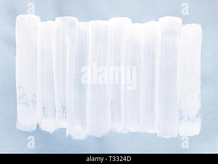 vertical white paint brush strokes on light blue paper. hand painted abstract background Stock Photo