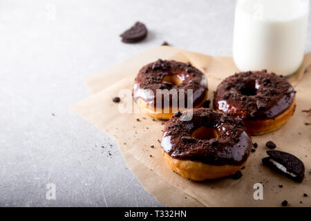 Pastries concept. Donuts with chocolate glaze and chocolate cookies/ Stock Photo