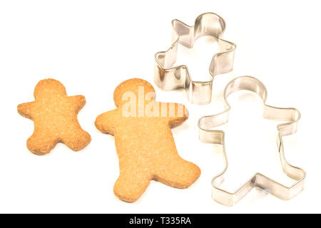 Gingerbread cookies with molds on white background Stock Photo