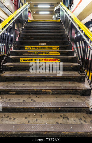 Old and worn stairs in subway station in New York City, USA Stock Photo