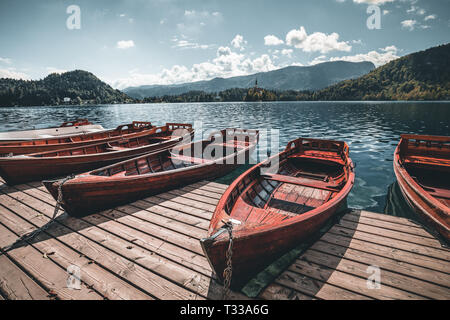 Traditional Pletna boat on the lake. In the background is the famous old church Stock Photo