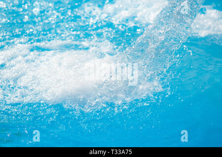 water jets current for body massage in the indoor pool close up Stock Photo