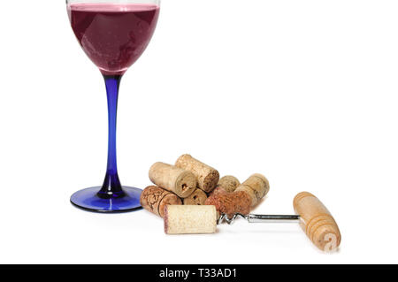 Glass of red sparkling wine near pile of corks and corkscrew isolated on white. Clipping path included. Copy space for your text Stock Photo