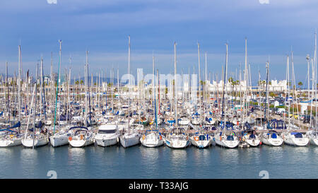 BARCELONA, SPAIN-MARCH 14, 2019: Lot of yachts near the mall de la marina in  the Port Olímpic Stock Photo