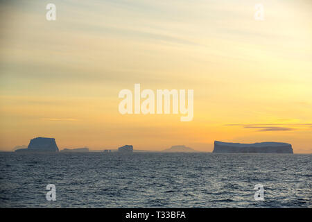 Tabular iceberg in Crystal sound, Antarctica at sunset Stock Photo