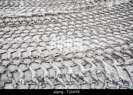 Traces of large tires, construction vehicle, in the sand, tire profiles, Stock Photo