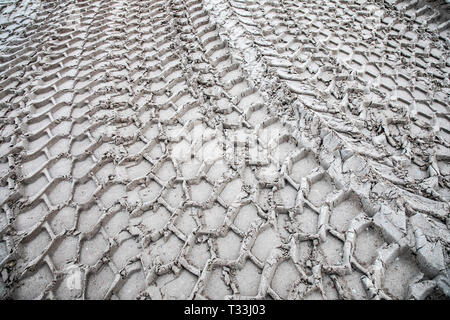 Traces of large tires, construction vehicle, in the sand, tire profiles, Stock Photo