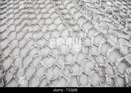 Traces of large tires, construction vehicle, in the sand, tire profiles, Stock Photo