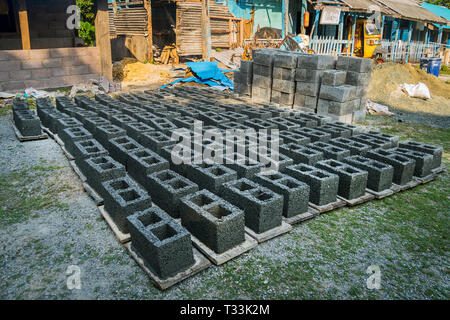 Production of brick blocks in Andaman and Nicobar Islands . drying bricks. homemade concrete blocks for construction Stock Photo