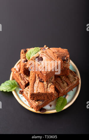 Healthy food concept Homemade organic fudge sunflower seeds butter brownies on black background Stock Photo