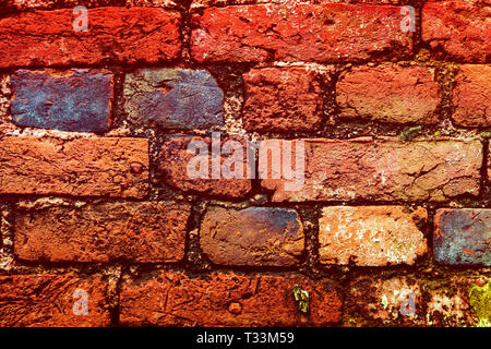 brick wall close-up. multi-colored bricks in the old wall close-up. Background in grunge style Stock Photo