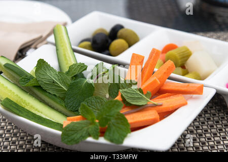 Fresh and pickled vegetables on a plates Stock Photo