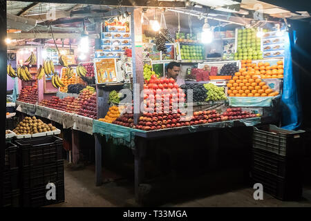 Port Blair Andaman and Nicobar Islands. India. 25 January 2018. Unidentified man woman at his fruit and or vegetables shop in the main market of the c Stock Photo