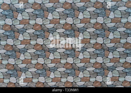 multicolored stone with rounded faces wall background. Seamless background Stock Photo