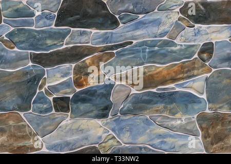 seamless ashlar stone wall texture background. textured wall. finish the fence with a rock Stock Photo