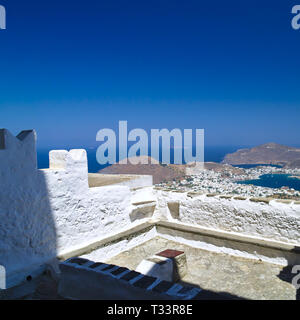 View to Skala village in Patmos island, Greece. White and blue contrasts, clear summer day. Stock Photo