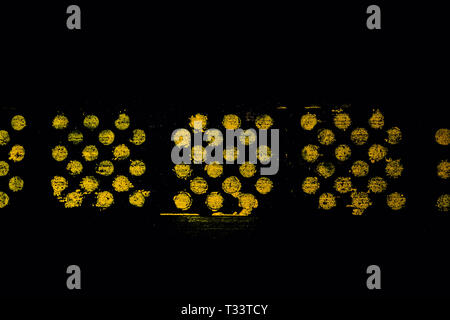yellow spray painted circles on the pavement Stock Photo