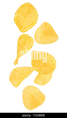 Falling potato chips isolated on white background. Stock Photo