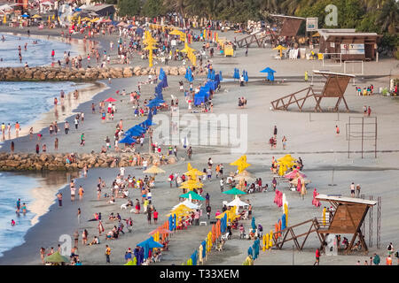 Cartagena Colombia,Bocagrande,Caribbean Sea public beach,sand water,umbrellas rental,Hispanic resident residents,man men male,woman female women,busy Stock Photo