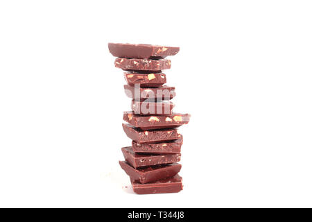 high stack of slices of original milk chocolate .isolated on white Stock Photo