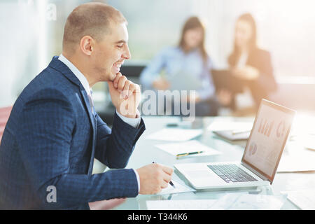 businessman using laptop to check financial data Stock Photo