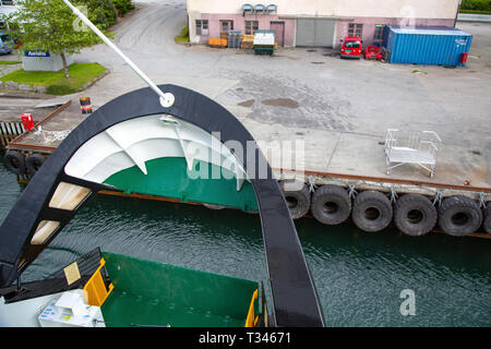 Near Geiranger, Norway - June, 2016: Ferryboat departure and close deck. Ferry bow closeup. Arrival of ferry to pier. Ferryboat departure and close de Stock Photo