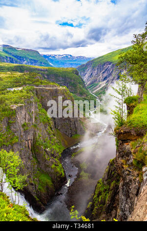 Falls in mountains of Norway. Voringsfossen Waterfall. Stock Photo