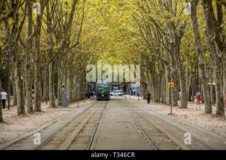 Bordeaux, France - September 9, 2018: The modern tram in the French city of Bordeaux, passing along the Allees de Munich, a leafy avenue in the center Stock Photo