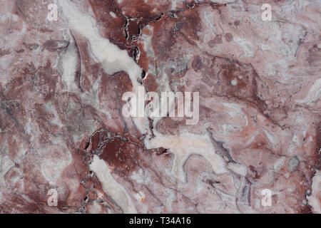 Classic travertine texture. Reddish-brown base with dark and gray spots. Used as a background. Copy space for your text. Stock Photo