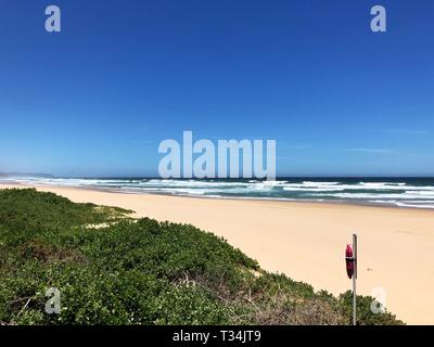 Life belt on an empty beach, Wilderness, Western Cape, South Africa Stock Photo