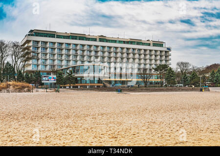 The spa house Baltyk is located on the beach of the Baltic Sea at the sea bridge in Kolobrzeg, West Pomeranian, Poland, Europe Stock Photo