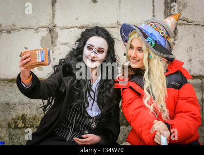 City of London, UK. 6th Apr, 2019. Two characters from 'The Adventure Zone' podcast chat and take selfies. Participants in colourful games characters and cosplayers, many with props and dressed in full outfits, join in the annual 'Games Character Parade'. The parade runs from Guildhall Yard, around St Paul's Cathedral and the City of London. It is part of the London Games Festival, which includes events at Tobacco Dock, Trafalgar Square and Somerset House. Credit: Imageplotter/Alamy Live News Stock Photo