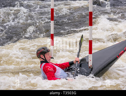 Grandtully, Perthshire, Scotland, United Kingdom, 6 April 2019. Grandtully Premier Canoe Slalom:  Finlay Yates-Jones from Llandysul Paddlers competes in the men's kayak on the River Tay Stock Photo