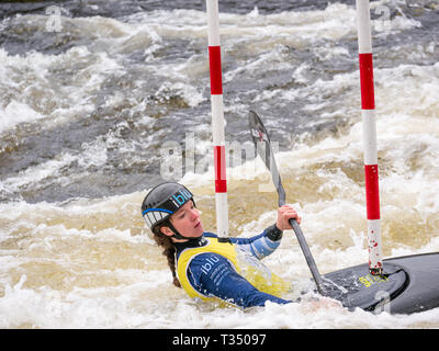 Grandtully, Perthshire, Scotland, United Kingdom, 6 April 2019. Grandtully Premier Canoe Slalom:  Amber Maslen competes in the women''s premier kayak  on the River Tay Stock Photo