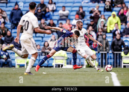 Santiago Bernabeu, Madrid, Spain. 6th Apr, 2019. La Liga football, Real Madrid versus Eibar; Karim Benzema (Real Madrid) challenged by Sergio Alvarez (SD Eibar) Credit: Action Plus Sports/Alamy Live News Stock Photo